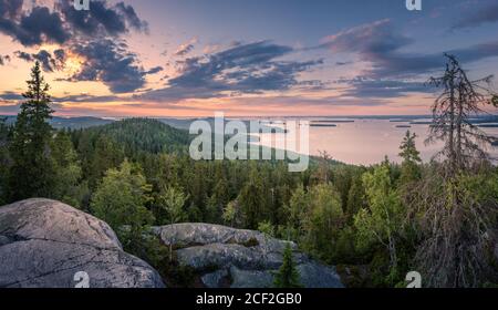 Scenic panorama landscape with lake and sunset at evening in Koli, national park, Finland Stock Photo