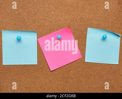 colorful paper stickers glued on brown board, idea and multitasking, close up Stock Photo