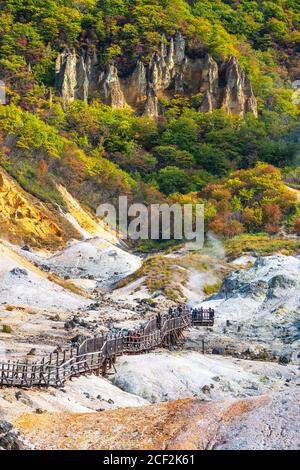 Jigokudani, known in English as 'Hell Valley' is the source of hot springs for many local Onsen Spas in Noboribetsu, Hokkaido, Japan. Stock Photo