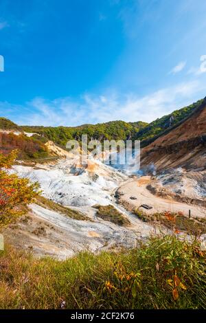 Jigokudani, known in English as 'Hell Valley' is the source of hot springs for many local Onsen Spas in Noboribetsu, Hokkaido, Japan. Stock Photo