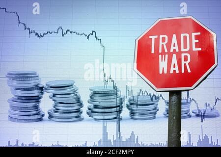 Trade war on economy background - graph and coins. Financial crash in world economy. Global economic crisis, recession.