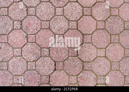 road paved with sidewalk tiles. beautiful brick background with, masonry texture of light brown bricks. outdoor closeup Stock Photo