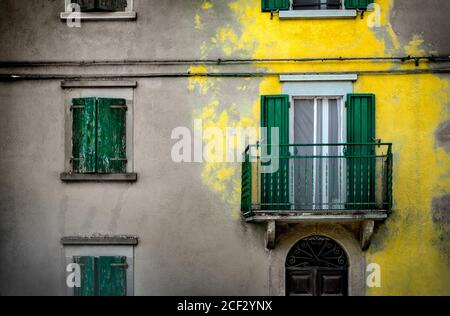 yellow splash color building background yellow plaster paint italian homes background Stock Photo