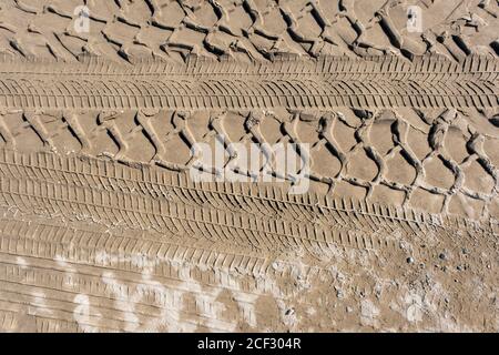 The trace of a tyre in the sand Stock Photo