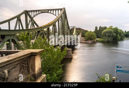 POTSDAM, GERMANY - Aug 14, 2020: POTSDAM, GERMANY August 14, 2020. The Glienicker Bridge at sunset and a long exposure. Stock Photo