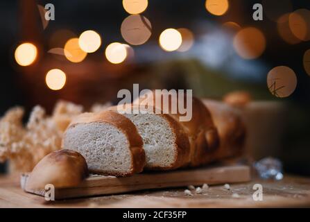 Close-up view of sliced bread on wooden board Stock Photo