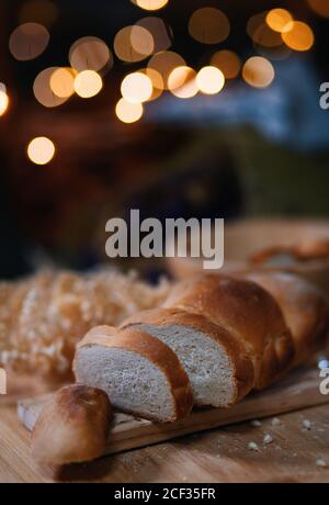 Close-up view of sliced bread on wooden board Stock Photo