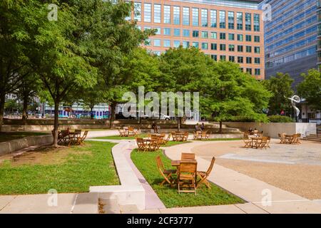 Reston, VA, USA -- September 2, 2020. Wide angle photo of people relaxing in Reston Town Square Park on a summer afternoon. Stock Photo