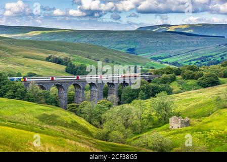 The Rail Charter Services rail tour The Staycation Express, crosses the Dent Head viaduct. Stock Photo