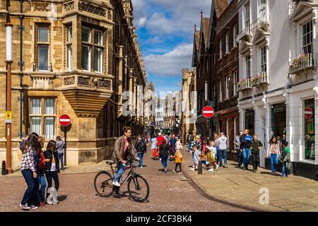 Cambridge City Centre, pedestrians and cyclists mix on Trinity Street in Central Cambridge UK. Stock Photo