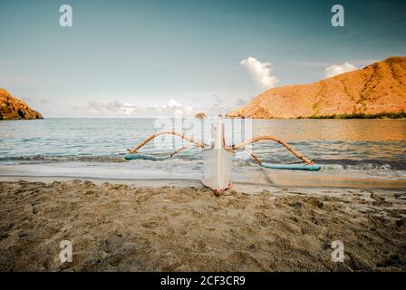 Lone boat at the shore of the beach at Zambales, Philippines. Stock Photo