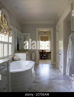 Country style bathroom with built-in bathtub Stock Photo
