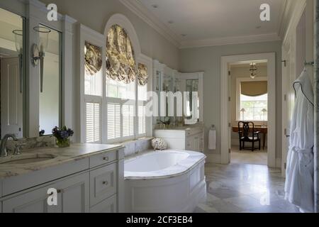 Country style bathroom with built-in bathtub Stock Photo