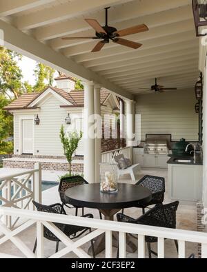 Dining and barbecue area on veranda Stock Photo