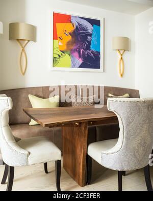 Modern dining room with painting of woman Stock Photo