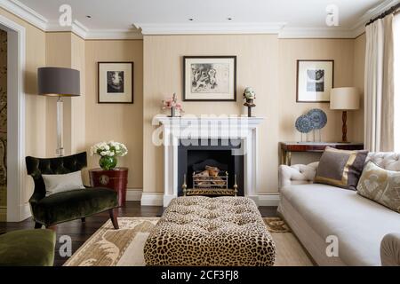 Country style living room with leopard print coffee table Stock Photo