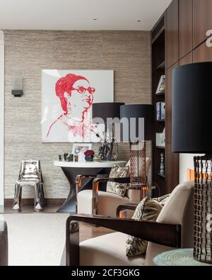 Painting of woman in modern living room Stock Photo