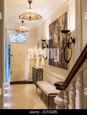 Lit lights in entrance hall Stock Photo