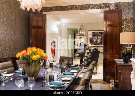 Set table in luxurious dining room Stock Photo