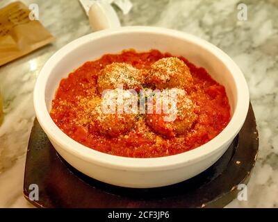 Meatball, ground meat rolled into a small ball, along with other ingredients, such as bread crumbs, minced onion, eggs, butter, and seasoning. Stock Photo