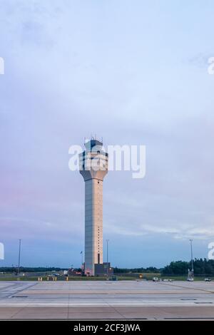 Dulles International Airport, IAD, control command center tower in evening blue twilight sky vertical view Stock Photo