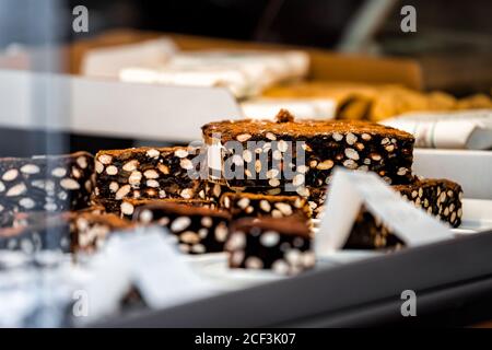 Closeup view of display of panforte chocolate dessert made with fruits and nuts in Siena, Italy in Tuscany Stock Photo