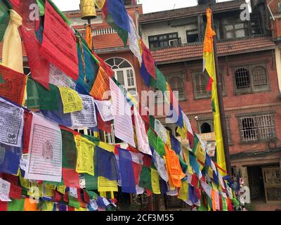 Prayer Buddhist flags  lung ta with mantras on the central square in Kathmandu, Nepal. It is designed to protect against evil and bless the area. Stock Photo