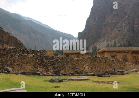 Partially restored buildings and stone wall of the Incan ruins at Ollantaytambo, in the Sacred Valley of Peru Stock Photo