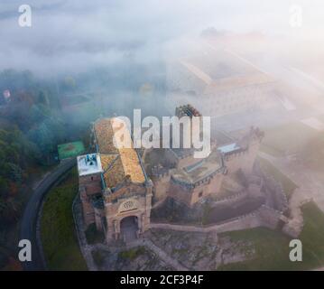 Aerial view of impressive medieval castle of Xavier with attached Basilica on hill in town of Javier, Navarre, Spain Stock Photo