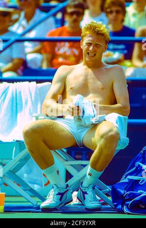 Boris Becker (GER) during a change over competing at the 1989 US Open Tennis. Stock Photo