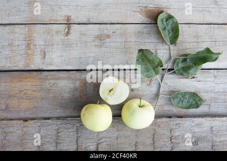 Three Apples on wooden background, autumn concept. Copy space Stock Photo