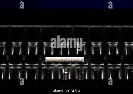 Warsaw, Poland - December 22, 2019: Old town at night with Warszawa famous street and illuminated sign on building exterior for luxury hotel europejsk Stock Photo