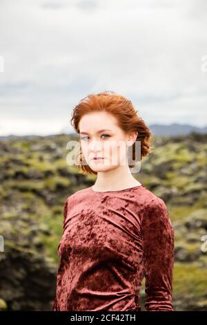 Fashion in unusal place, Iceland, lava and moss Stock Photo