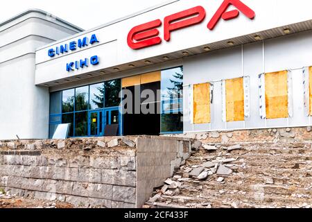 Rivne, Ukraine - July 3, 2018: Old run-down abandoned building in western Ukrainian city with broken exterior and sign for cinema movie theater epa du Stock Photo