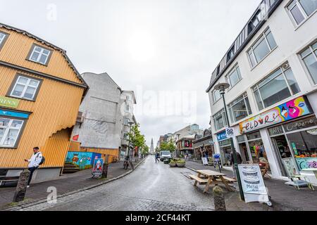 Reykjavik, Iceland - June 19, 2018: Wet street road and wide angle view of downtown center and famous Hallgrimskirkja church Stock Photo