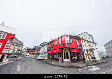 Reykjavik, Iceland - June 19, 2018: Street road in downtown district with red colorful house building Icewear wool house shop store wide angle view Stock Photo