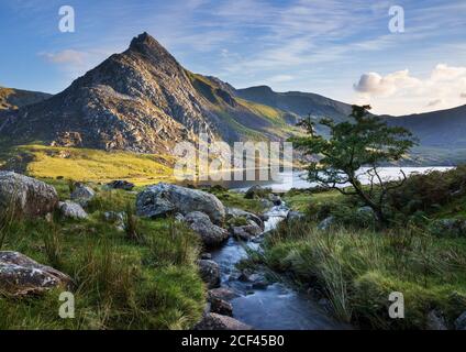 Tryfan is a mountain in the Ogwen Valley, Snowdonia, Wales. It forms part of the Glyderau group, and is one of the most famous and recognisable peaks Stock Photo