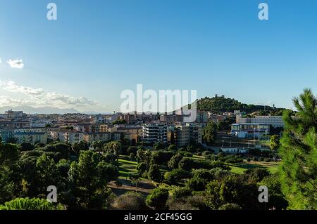 aerial cityscape medieval Castle on a hill with modern city Stock Photo