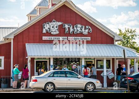 Remington, USA - August 30, 2020: People standing waiting in line too close in violation of social distancing to buy ice cream at local dairy creamery Stock Photo