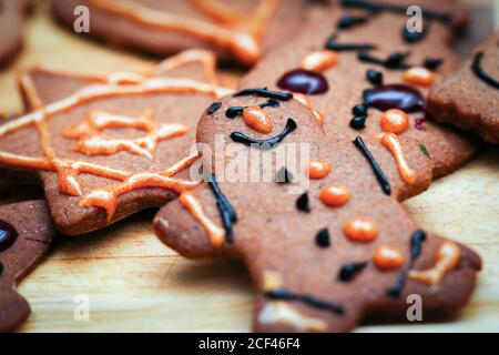 Closeup on children hand decorated christmas gingerbread cookie man figurine Stock Photo