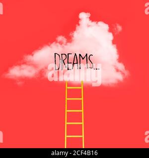 White cloud on a red background and a Dream phrase. Creative concept, minimalism Stock Photo