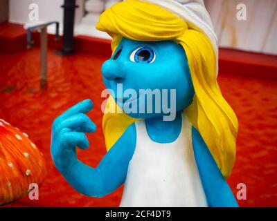 A Coruna, Spain - August 27, 2020 - Foreground of a Smurfette female Smurf figure in the Comic salon in A Coruna Stock Photo