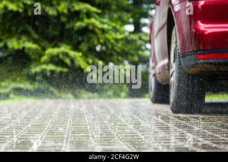 raindrops fall on a paved area, blurred background Stock Photo