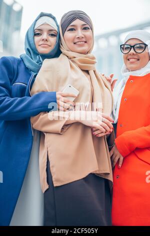 Attractive young muslim ladys with hijab are looking at camera. outdoor. Stock Photo
