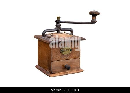 Old vintage manual wooden Peugeot coffee grinder mill with closed drawer isolated on white background. Stock Photo