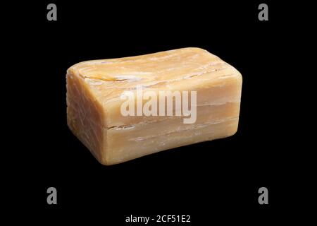 Natural handmade Marseille soap bar isolated on black background. Stock Photo
