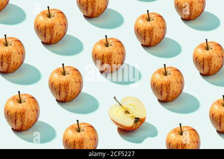 From above ripe tasty red orange apples on white surface Stock Photo