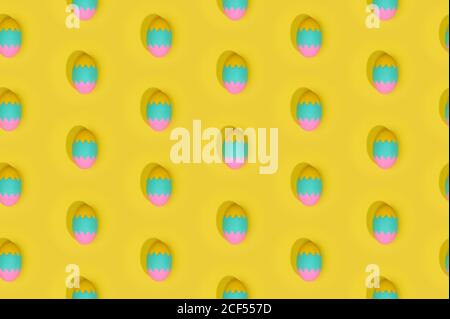 Seamless Easter pattern with colored decorated eggs arranged in rows on yellow background Stock Photo