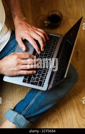 Bearded freelancer using laptop at home Stock Photo