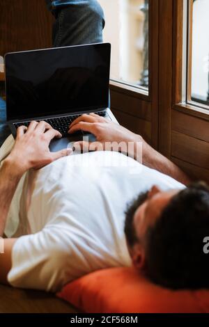 Freelancer using laptop at home Stock Photo